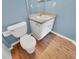 Simple bathroom with toilet and vanity at 205 Hibiscus St, Winter Haven, FL 33881