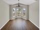 Bright dining area with bay window and wood flooring at 205 Hibiscus St, Winter Haven, FL 33881