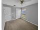 Simple bedroom with neutral walls and carpet at 205 Hibiscus St, Winter Haven, FL 33881