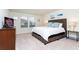 Spacious bedroom with king-size bed and TV at 2429 Dubai St, Kissimmee, FL 34747