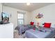 Two twin beds with themed bedding in a well-lit bedroom at 2429 Dubai St, Kissimmee, FL 34747