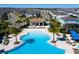 Aerial view of community pool with lounge chairs at 2429 Dubai St, Kissimmee, FL 34747