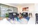 Living room with two sofas, coffee table, and sliding glass doors to patio at 2429 Dubai St, Kissimmee, FL 34747
