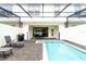 Private pool and patio with lounge chairs and grill at 2429 Dubai St, Kissimmee, FL 34747