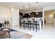 Open kitchen with island, stainless steel appliances, and dark cabinetry at 2429 Dubai St, Kissimmee, FL 34747
