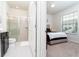 Bedroom with adjoining bathroom with shower and vanity at 2429 Dubai St, Kissimmee, FL 34747
