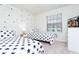 Two twin beds with star-themed bedding in a bright bedroom at 2429 Dubai St, Kissimmee, FL 34747