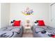 Two twin beds with themed bedding and a nightstand at 2429 Dubai St, Kissimmee, FL 34747