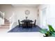 Small dining area with round table and four chairs, near staircase at 2429 Dubai St, Kissimmee, FL 34747