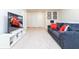 Upstairs loft area with large TV and comfortable seating at 2429 Dubai St, Kissimmee, FL 34747