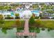Wooden community dock extending over a calm lake at 2429 Dubai St, Kissimmee, FL 34747