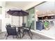 Private patio with table and chairs, view of living room at 2429 Dubai St, Kissimmee, FL 34747