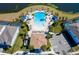 Aerial view of resort-style pool with lounge chairs and patio area at 2429 Dubai St, Kissimmee, FL 34747