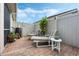 Relaxing brick patio with lounge chairs, offering a private outdoor space at 442 Ella Mae Dr, Davenport, FL 33897
