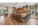 Open kitchen with large island, breakfast bar seating, and wood flooring at 442 Ella Mae Dr, Davenport, FL 33897