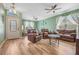 Relaxing living room with leather furniture and hardwood floors at 442 Ella Mae Dr, Davenport, FL 33897