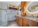 Elegant bathroom with dual sinks, granite counters, and a large shower at 442 Ella Mae Dr, Davenport, FL 33897