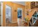 Bright hallway with access to bedrooms and a wet bar at 442 Ella Mae Dr, Davenport, FL 33897