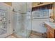 Spa-like bathroom with glass shower, granite flooring, and modern fixtures at 442 Ella Mae Dr, Davenport, FL 33897