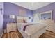 Serene bedroom with a queen bed, light walls, and a ceiling fan at 442 Ella Mae Dr, Davenport, FL 33897