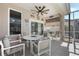 Covered patio with table and chairs, ideal for dining al fresco at 442 Ella Mae Dr, Davenport, FL 33897