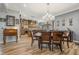 Open dining room with hardwood floors and view of kitchen at 442 Ella Mae Dr, Davenport, FL 33897