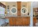 Bathroom boasting dual vanities, granite countertops, and modern lighting at 442 Ella Mae Dr, Davenport, FL 33897