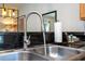 Modern kitchen sink with a sleek gooseneck faucet at 3084 Yellow Lantana Ln, Kissimmee, FL 34747