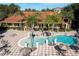 Resort-style pool with lounge chairs and umbrellas at 3084 Yellow Lantana Ln, Kissimmee, FL 34747