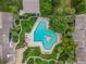Unique shaped community pool surrounded by tropical landscaping at 200 Maitland Ave # 20, Altamonte Springs, FL 32701