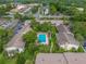 Community pool with surrounding patio and lush landscaping at 200 Maitland Ave # 20, Altamonte Springs, FL 32701