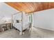 Bedroom with a canopy bed and wood ceiling, near window at 200 Maitland Ave # 20, Altamonte Springs, FL 32701