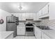 Clean kitchen with stainless steel appliances and light gray countertops at 200 Maitland Ave # 20, Altamonte Springs, FL 32701