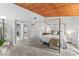 Bright bedroom with a canopy bed and wood ceiling at 200 Maitland Ave # 20, Altamonte Springs, FL 32701
