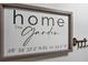 Home entryway with key holder and framed home coordinates sign at 200 Maitland Ave # 20, Altamonte Springs, FL 32701