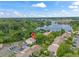 Aerial view showing condo location near lake with parking and lush landscaping at 200 Maitland Ave # 20, Altamonte Springs, FL 32701