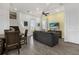 Living room with gray sofa and dining area, offering a comfortable space at 2956 Salted Rim Rd, Kissimmee, FL 34747