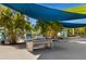 Outdoor ping pong table with shade sails, perfect for recreation at 2956 Salted Rim Rd, Kissimmee, FL 34747