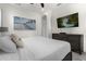 Spacious bedroom with large bed, TV, and dresser at 2956 Salted Rim Rd, Kissimmee, FL 34747