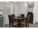 Small dining area with a round table and four chairs, perfect for intimate gatherings at 2956 Salted Rim Rd, Kissimmee, FL 34747