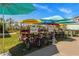 Four-person surreys available for rent at the beach club at 2956 Salted Rim Rd, Kissimmee, FL 34747