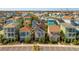 Aerial view showcasing a community of colorful, two-story homes at 2956 Salted Rim Rd, Kissimmee, FL 34747