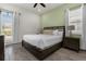Spacious main bedroom with a comfortable bed and plenty of natural light at 2956 Salted Rim Rd, Kissimmee, FL 34747