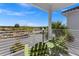 Private balcony with green chairs and community view at 2956 Salted Rim Rd, Kissimmee, FL 34747
