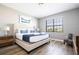 Main bedroom with king-size bed, nightstands and large window at 5300 Oakbourne Ave, Davenport, FL 33837