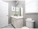 Bathroom with single vanity, toilet and shower/tub combo at 5300 Oakbourne Ave, Davenport, FL 33837