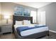 Main bedroom with a king-size bed and nightstands at 5300 Oakbourne Ave, Davenport, FL 33837