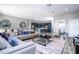 Spacious living area with comfortable seating and views of the kitchen at 5300 Oakbourne Ave, Davenport, FL 33837