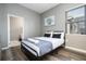 Bright bedroom with a queen bed and an ensuite bathroom at 5300 Oakbourne Ave, Davenport, FL 33837