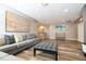 Living area with gray sectional sofa and ottoman at 5300 Oakbourne Ave, Davenport, FL 33837